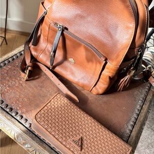 The Trend Tan Leather Backpack & Guess Wallet together as a non-matchy set.